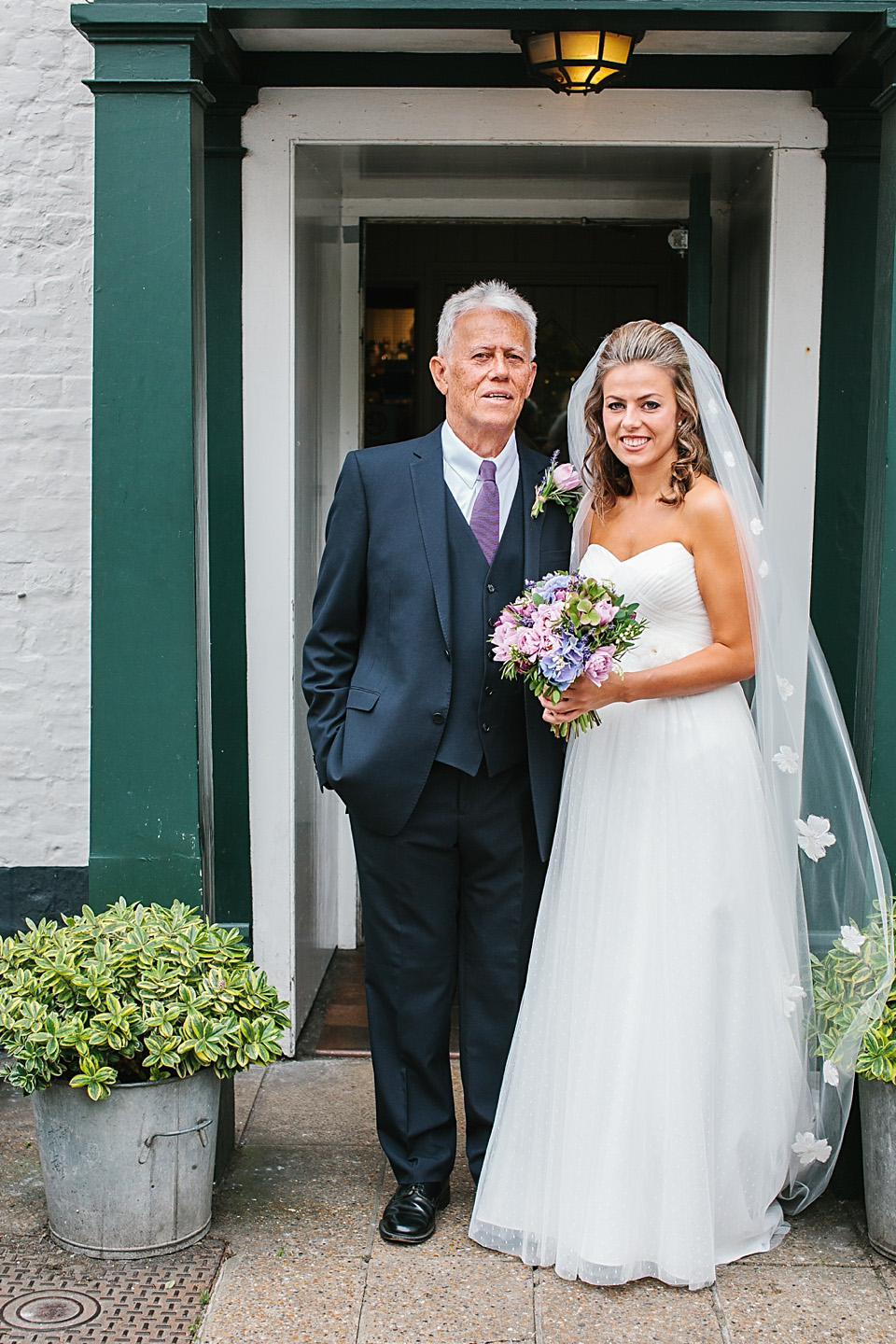 A bride wearing a David's Bridal gown and veil for her laid back and elegant wedding in Rye. Photography by Richard Ware. davids bridal, rye weddings, richard ware photography