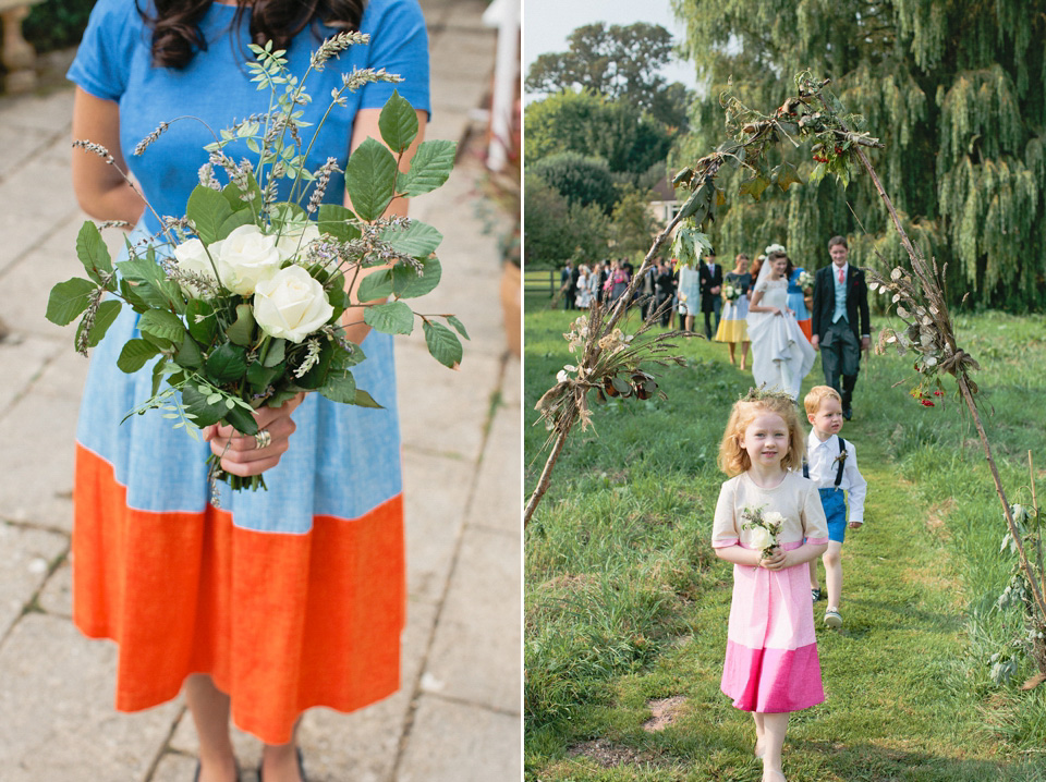 A bride wearing fresh flowers in her hair for her colourful English country garden wedding. Dress by Eponine London and photography by Rosie Anderson. eponine london, colourful wedding, english country garden wedding, rosemary anderson photography, flowers in her hair