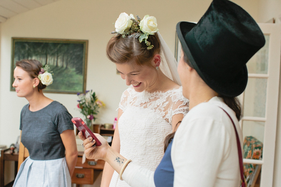 A bride wearing fresh flowers in her hair for her colourful English country garden wedding. Dress by Eponine London and photography by Rosie Anderson. eponine london, colourful wedding, english country garden wedding, rosemary anderson photography, flowers in her hair
