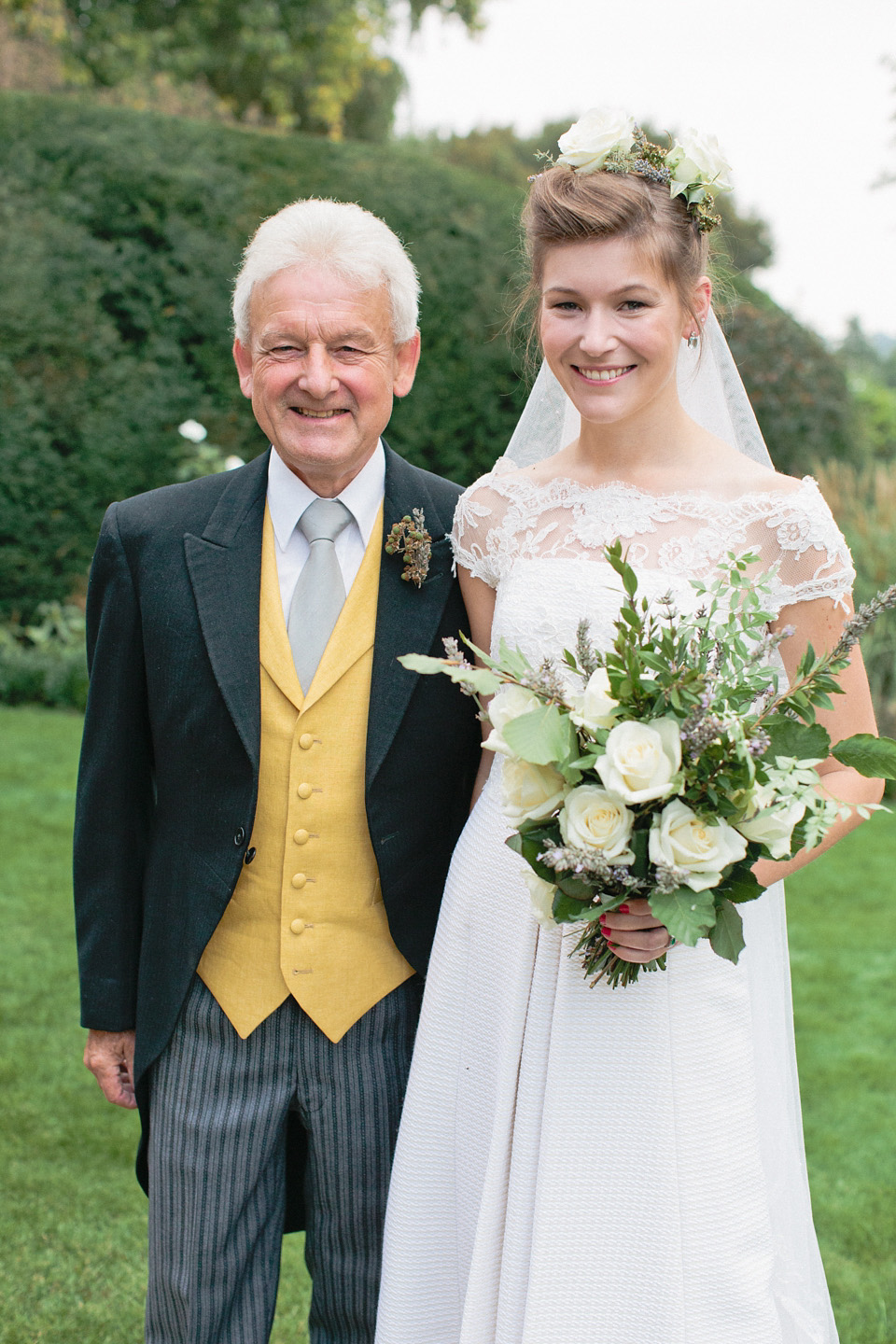 A bride wearing fresh flowers in her hair for her colourful English country garden wedding. Dress by Eponine London and photography by Rosie Anderson. eponine london, colourful wedding, english country garden wedding, rosemary anderson photography, flowers in her hair