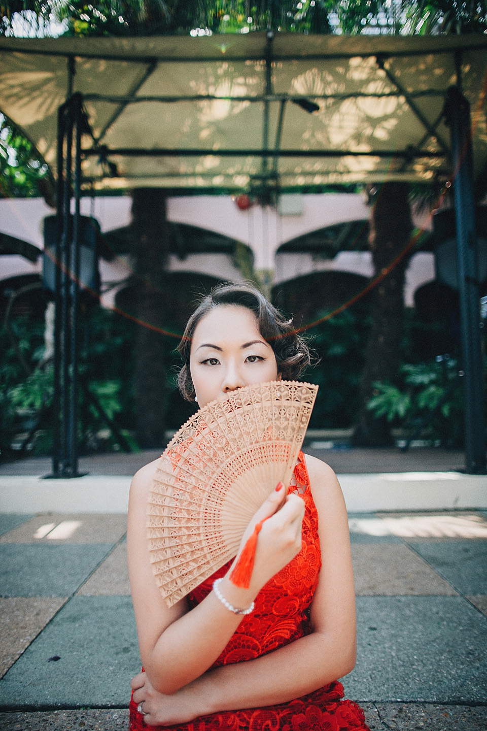 chinese bride, red wedding dress, kensington rooftop gardens, nicholas lau photography