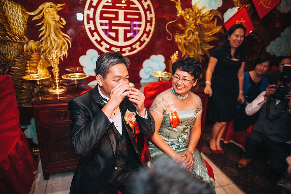 chinese bride, red wedding dress, kensington rooftop gardens, nicholas lau photography