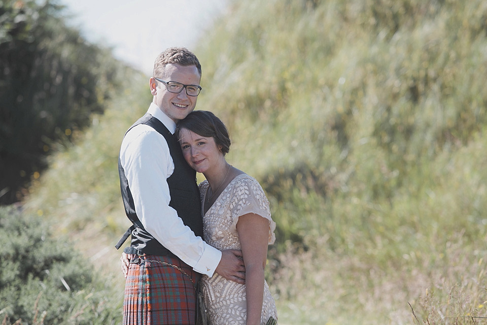 A bride wearing a beautifully embellished Eliza Jane Howell wedding dress for her seaside Scottish humanist wedding ceremony. Images by Mirrorbox Photography. mirrorbox photography, humanist ceremony, beach wedding, seaside wedding, eliza jane howell wedding dress