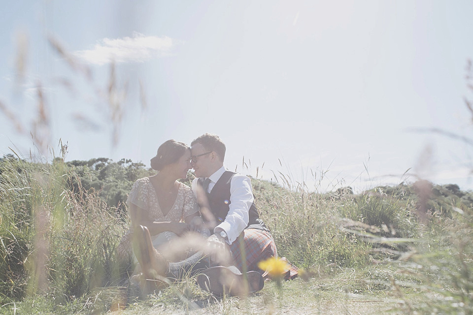 A bride wearing a beautifully embellished Eliza Jane Howell wedding dress for her seaside Scottish humanist wedding ceremony. Images by Mirrorbox Photography. mirrorbox photography, humanist ceremony, beach wedding, seaside wedding, eliza jane howell wedding dress