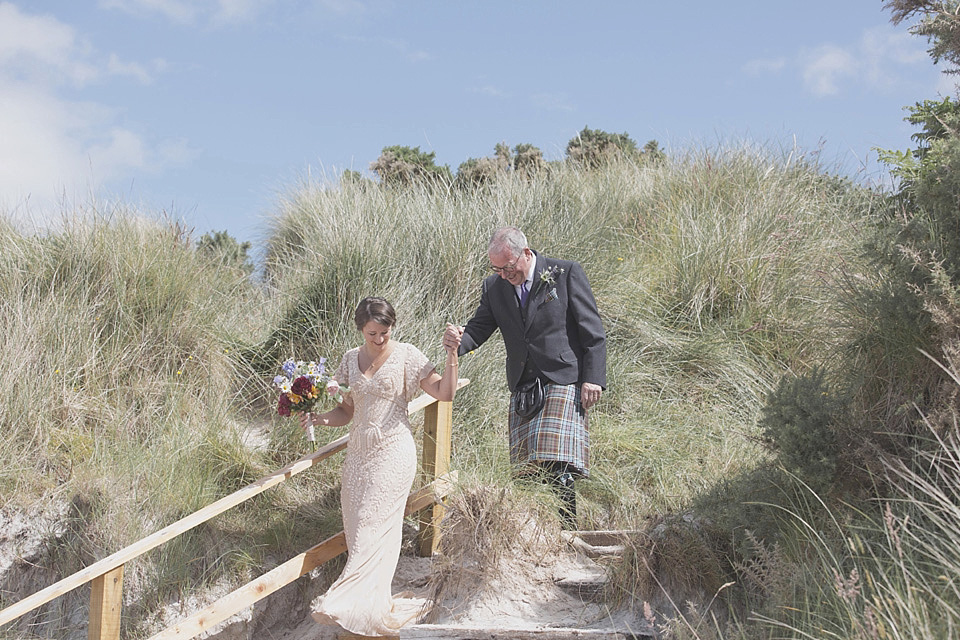 A bride wearing a beautifully embellished Eliza Jane Howell wedding dress for her seaside Scottish humanist wedding ceremony. Images by Mirrorbox Photography. mirrorbox photography, humanist ceremony, beach wedding, seaside wedding, eliza jane howell wedding dress