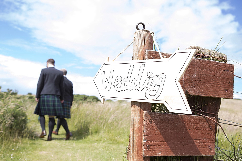 A bride wearing a beautifully embellished Eliza Jane Howell wedding dress for her seaside Scottish humanist wedding ceremony. Images by Mirrorbox Photography. mirrorbox photography, humanist ceremony, beach wedding, seaside wedding, eliza jane howell wedding dress