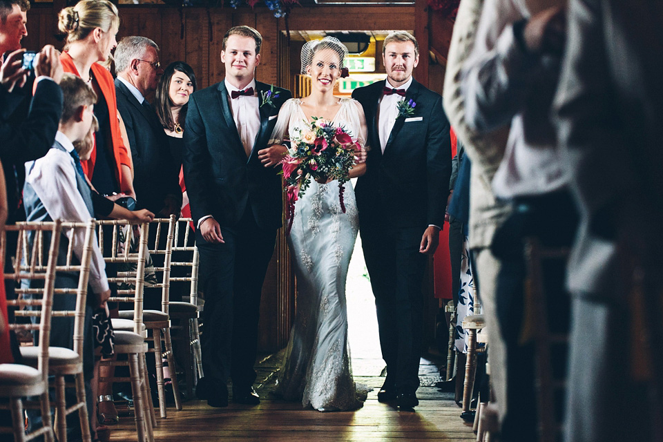 A bride wearing two dresses (including a Tadashi Shoji evening gown) for her glamorous, Gatsby inspired barn wedding. Photography by Mister Phill. mister phill photography, gastsby wedding, rustic barn wedding, tadashi shoji wedding dress