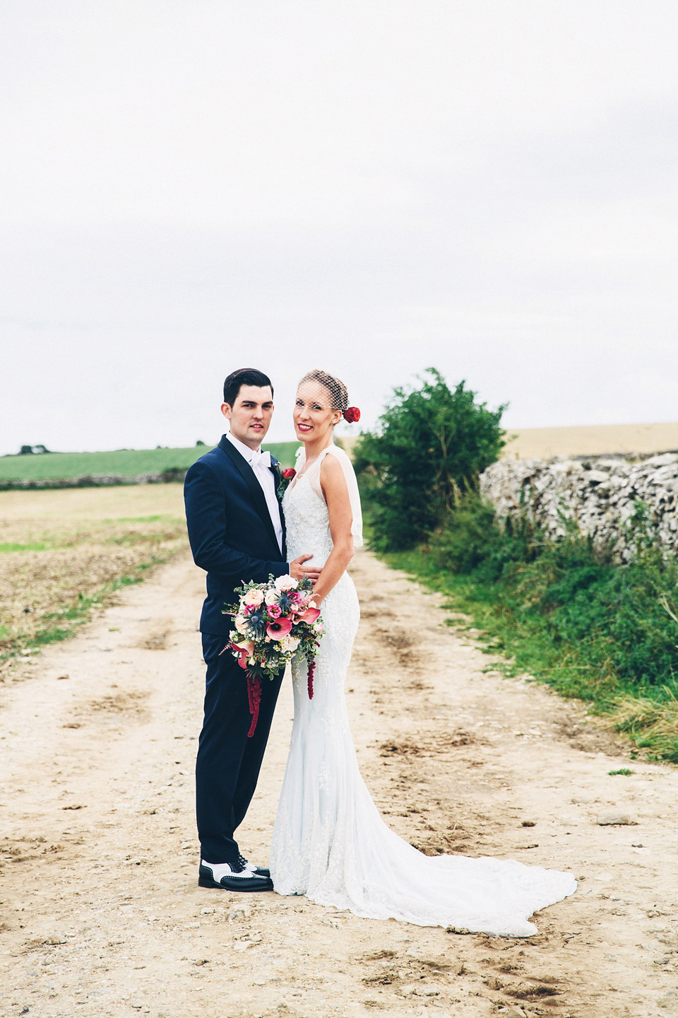 A bride wearing two dresses (including a Tadashi Shoji evening gown) for her glamorous, Gatsby inspired barn wedding. Photography by Mister Phill. mister phill photography, gastsby wedding, rustic barn wedding, tadashi shoji wedding dress
