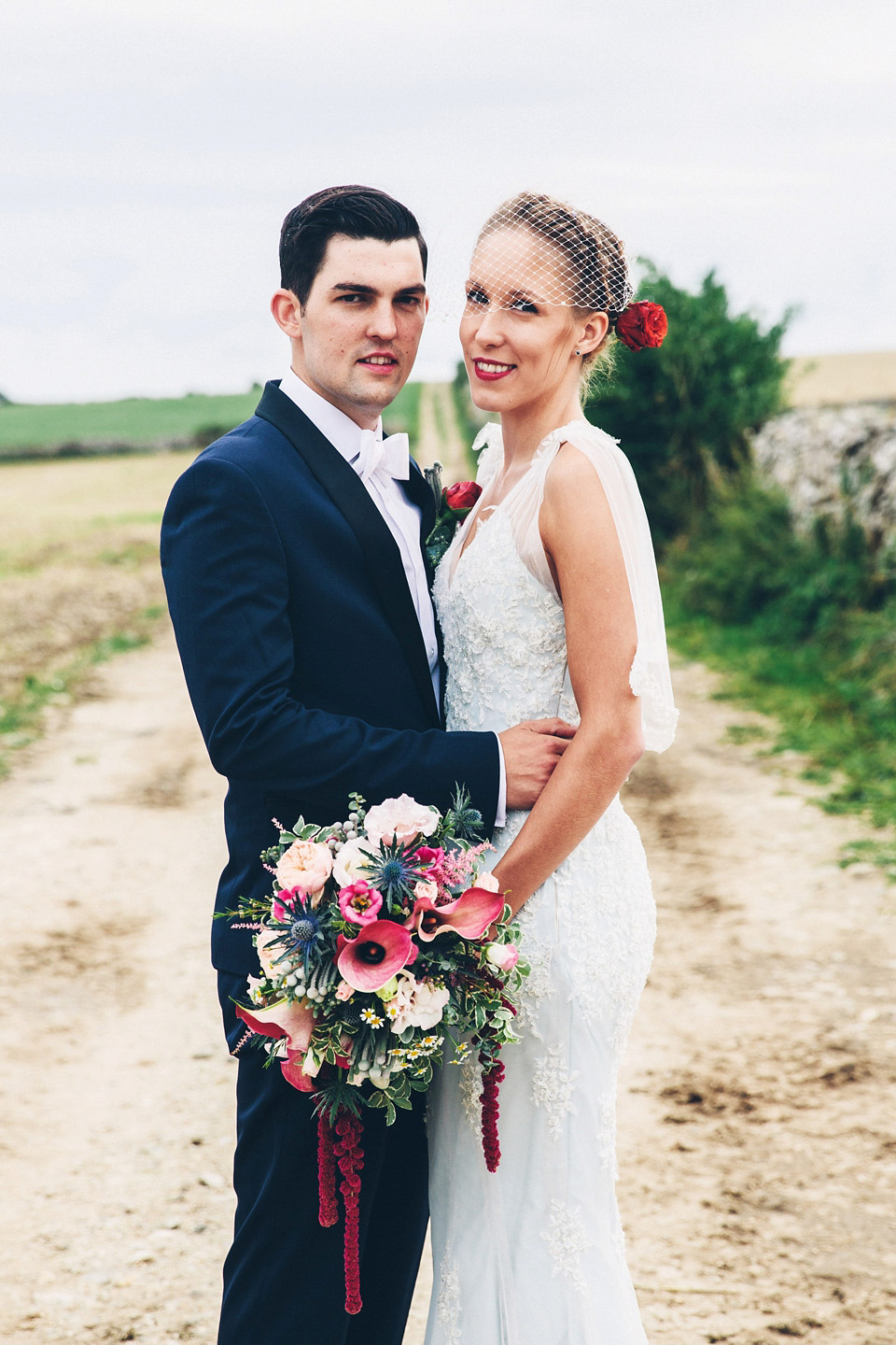 A bride wearing two dresses (including a Tadashi Shoji evening gown) for her glamorous, Gatsby inspired barn wedding. Photography by Mister Phill. mister phill photography, gastsby wedding, rustic barn wedding, tadashi shoji wedding dress