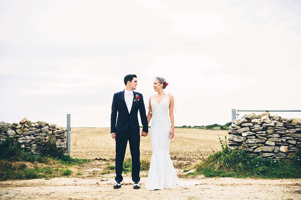 A bride wearing two dresses (including a Tadashi Shoji evening gown) for her glamorous, Gatsby inspired barn wedding. Photography by Mister Phill. mister phill photography, gastsby wedding, rustic barn wedding, tadashi shoji wedding dress