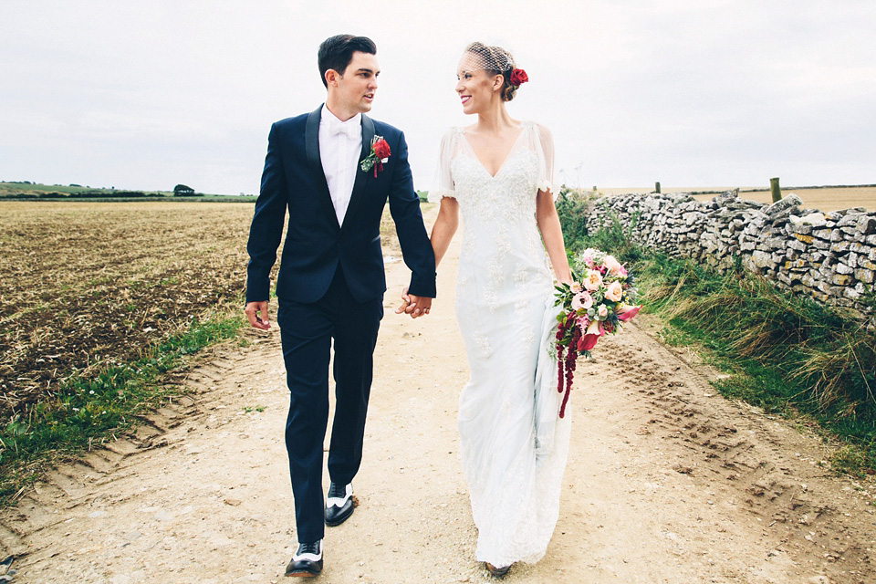 A bride wearing two dresses (including a Tadashi Shoji evening gown) for her glamorous, Gatsby inspired barn wedding. Photography by Mister Phill. mister phill photography, gastsby wedding, rustic barn wedding, tadashi shoji wedding dress