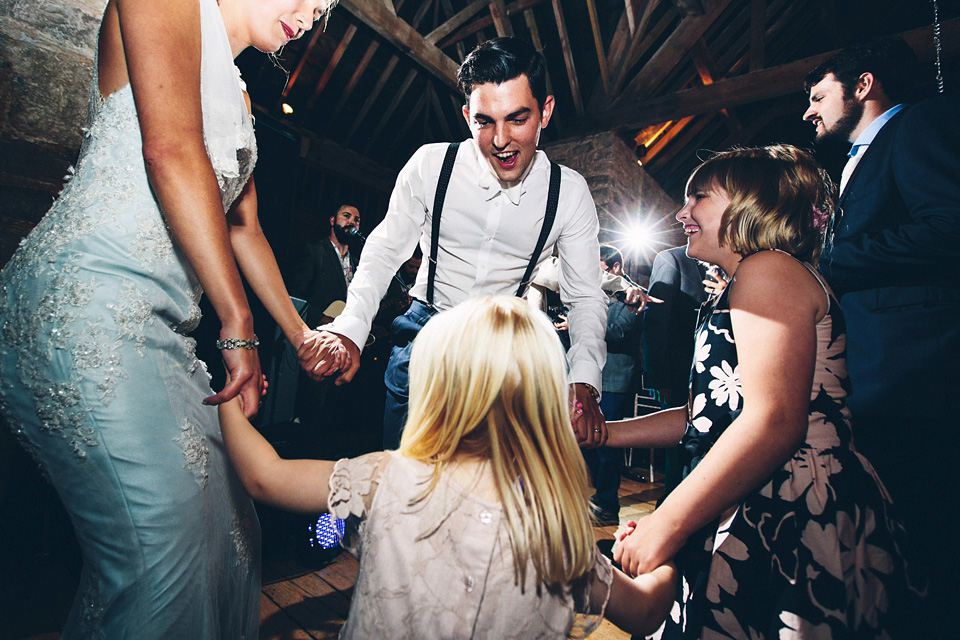 A bride wearing two dresses (including a Tadashi Shoji evening gown) for her glamorous, Gatsby inspired barn wedding. Photography by Mister Phill. mister phill photography, gastsby wedding, rustic barn wedding, tadashi shoji wedding dress