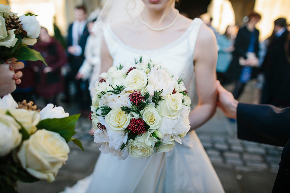 A bride wearing Alan Hannah for her Glouceste Cathedral winter wedding. Photography by Ruth Atkinson. alan hannah wedding dress, gloucester cathedral wedding, ruth atkinson photogarphy, winter wedding