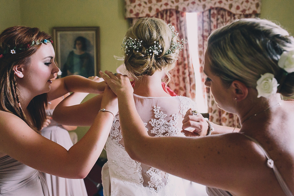 A bride wearing San Patrick for her Humanist handfasting ceremony at Talton Lodge. Photography by Sara Lincoln.