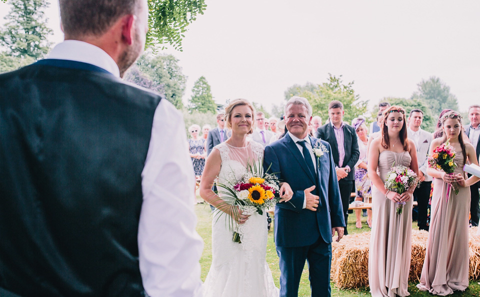 A bride wearing San Patrick for her Humanist handfasting ceremony at Talton Lodge. Photography by Sara Lincoln.