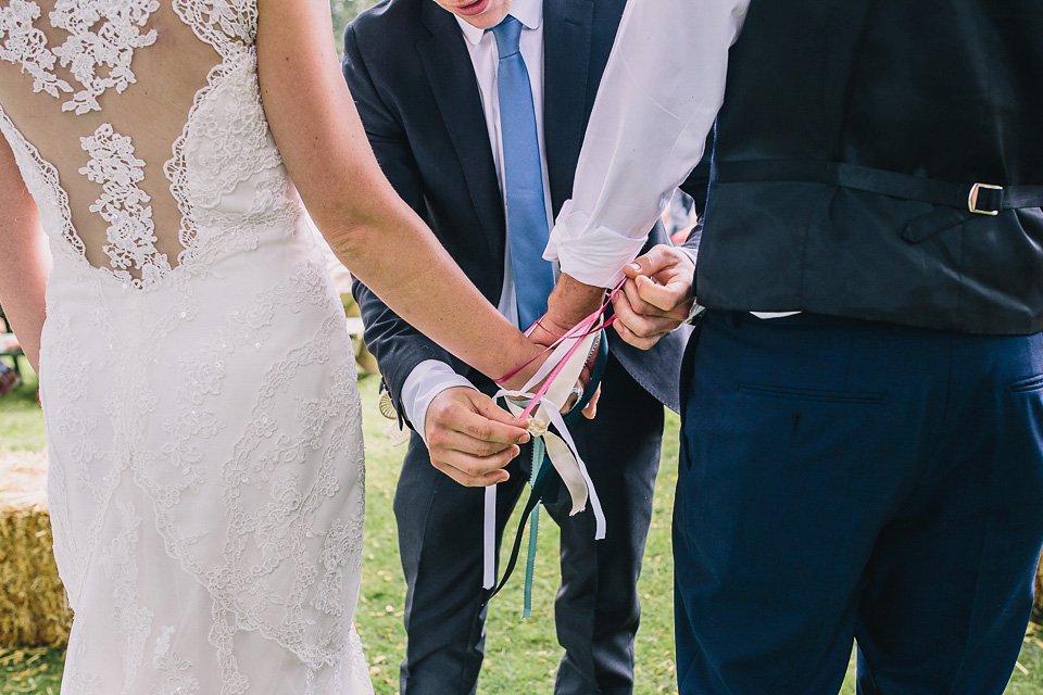 A bride wearing San Patrick for her Humanist handfasting ceremony at Talton Lodge. Photography by Sara Lincoln.