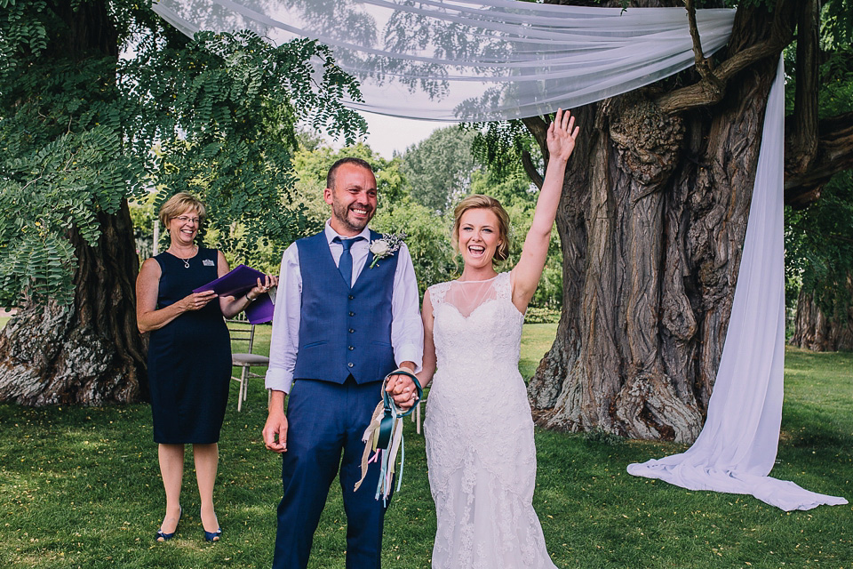 A bride wearing San Patrick for her Humanist handfasting ceremony at Talton Lodge. Photography by Sara Lincoln.