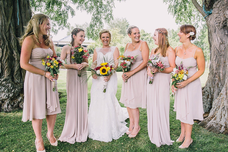 A bride wearing San Patrick for her Humanist handfasting ceremony at Talton Lodge. Photography by Sara Lincoln.