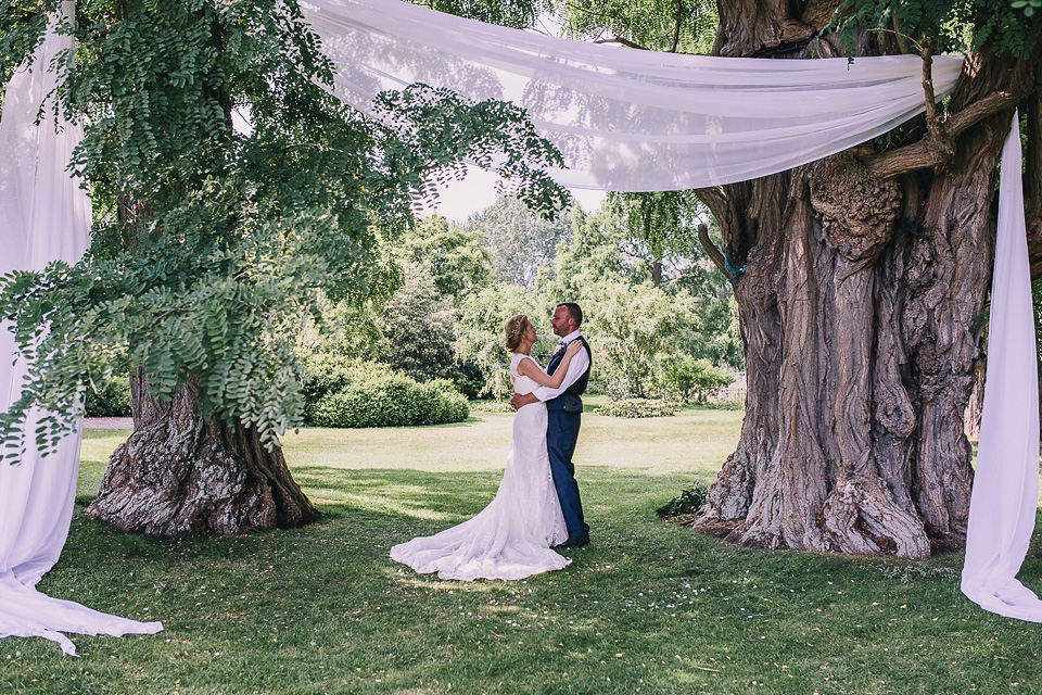 A bride wearing San Patrick for her Humanist handfasting ceremony at Talton Lodge. Photography by Sara Lincoln.