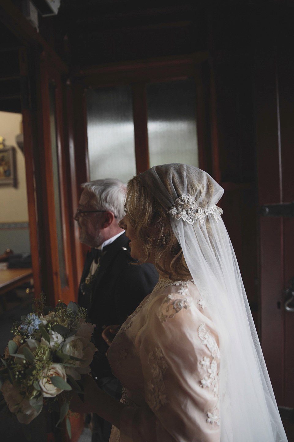 A bride wearing a ballerina length dress and Juliet cap veil for her soft blush pink and liberty print inspired wedding in Scotland.  Photography by Mirrorbox Photography.