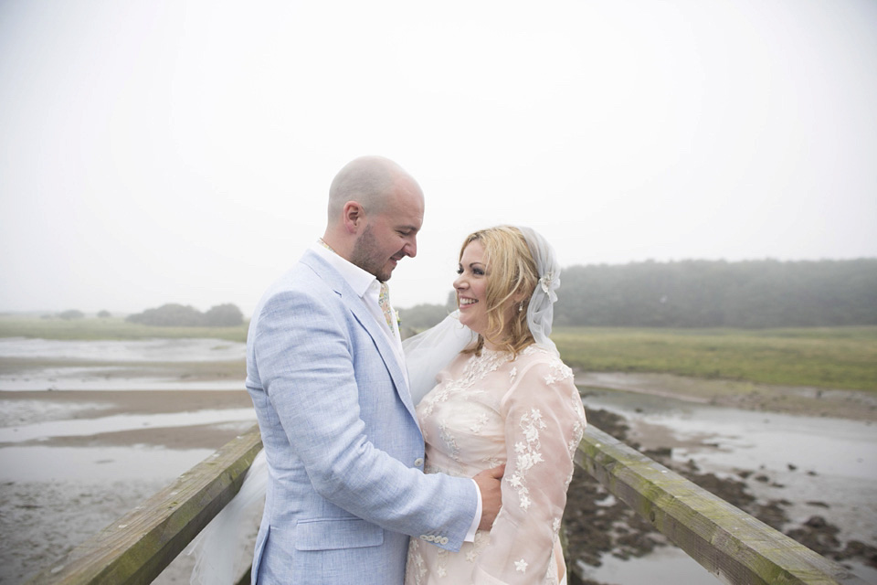 A bride wearing a ballerina length dress and Juliet cap veil for her soft blush pink and liberty print inspired wedding in Scotland.  Photography by Mirrorbox Photography.