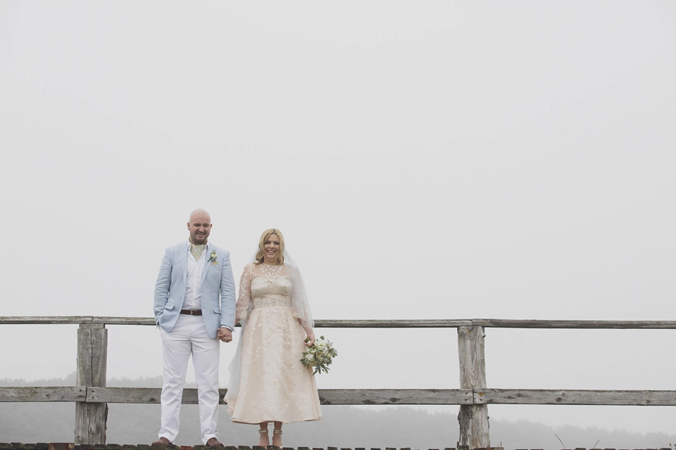 A bride wearing a ballerina length dress and Juliet cap veil for her soft blush pink and liberty print inspired wedding in Scotland.  Photography by Mirrorbox Photography.