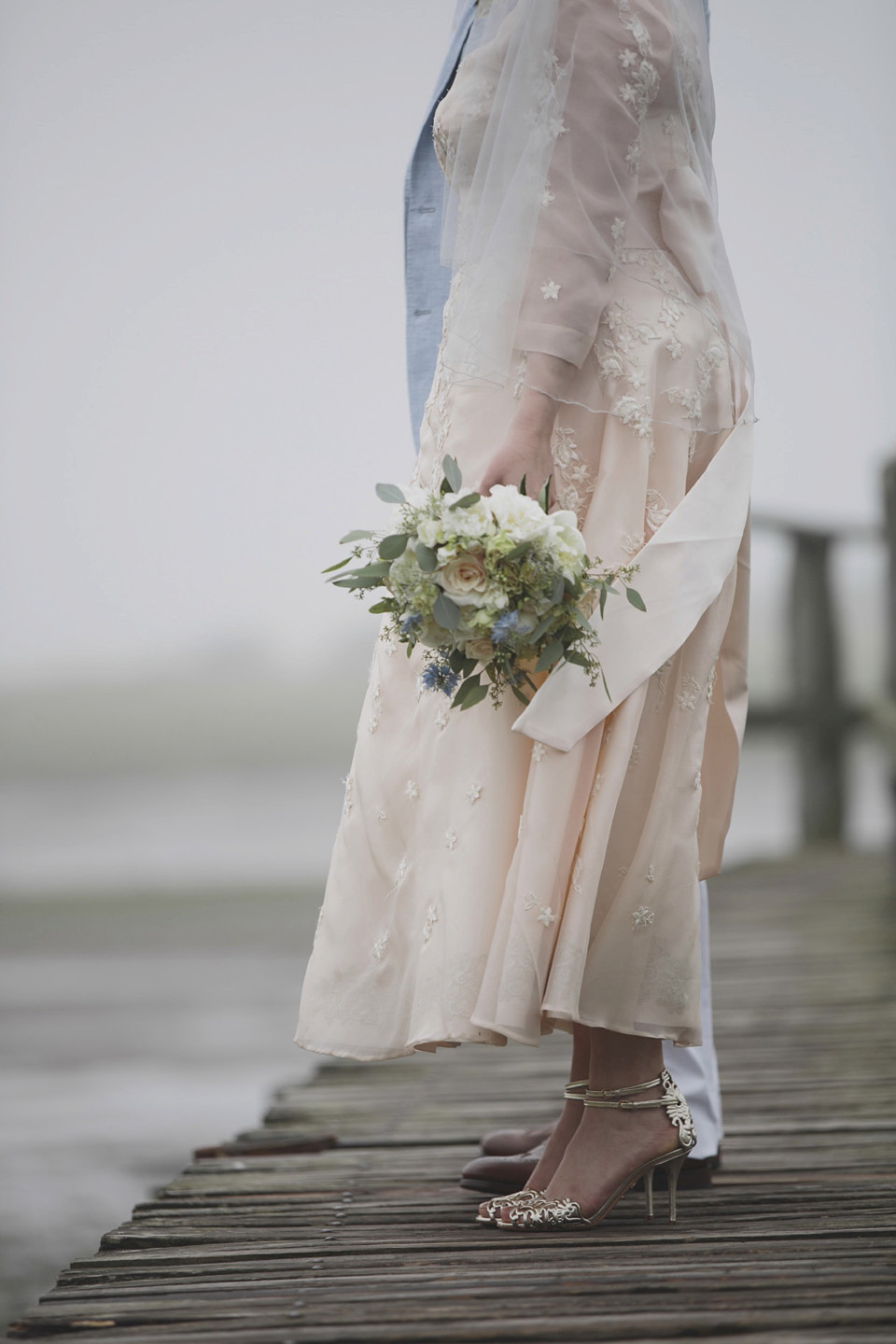 A bride wearing a ballerina length dress and Juliet cap veil for her soft blush pink and liberty print inspired wedding in Scotland.  Photography by Mirrorbox Photography.