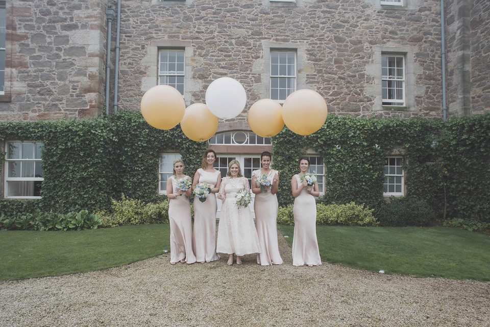 A bride wearing a ballerina length dress and Juliet cap veil for her soft blush pink and liberty print inspired wedding in Scotland.  Photography by Mirrorbox Photography.