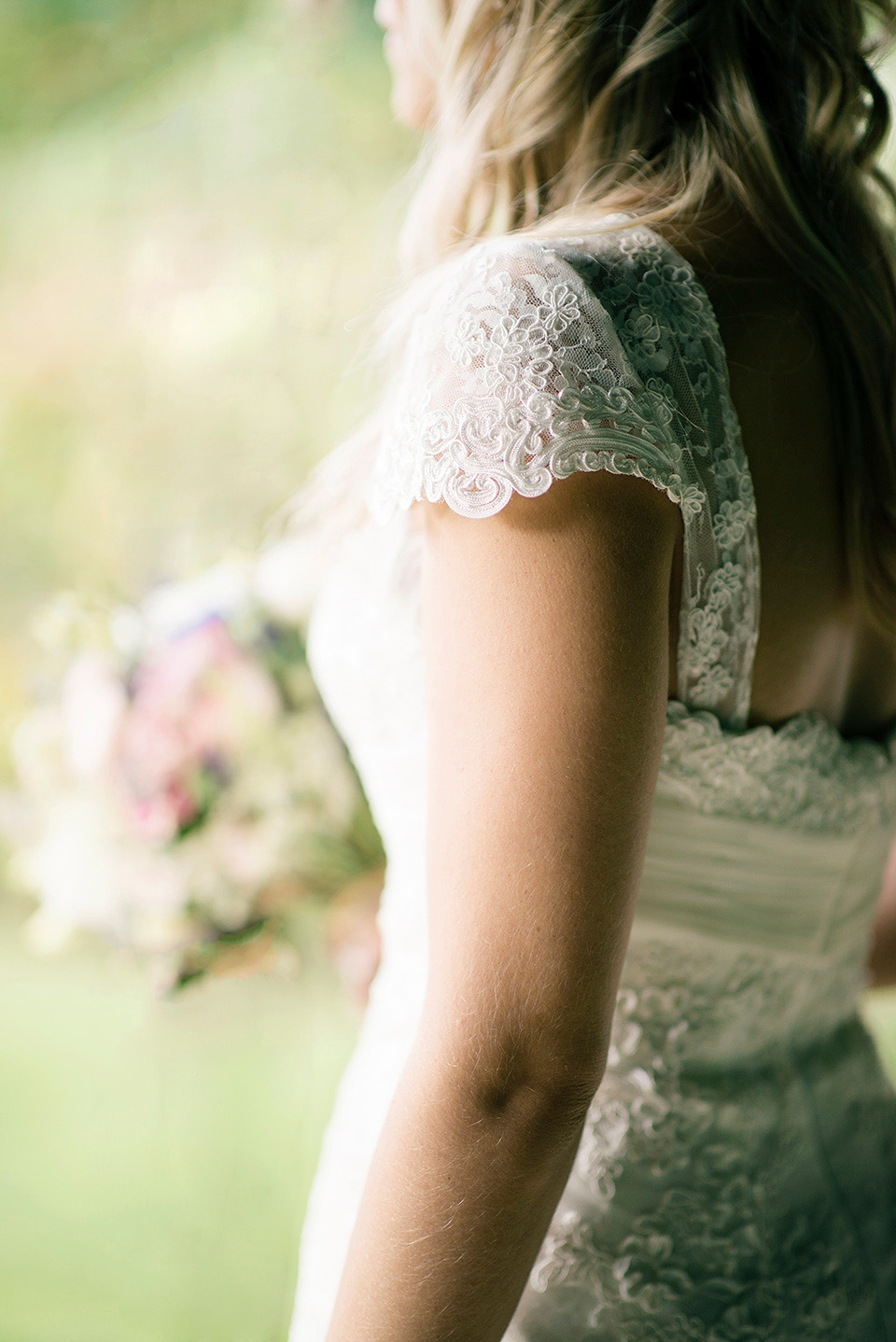 The bride wears a Bo & Luca headpiece and pretty Pronovias gown for her Summer country house wedding at Woodhall Manor in Suffolk. Photography by Kathryn Hopkins.