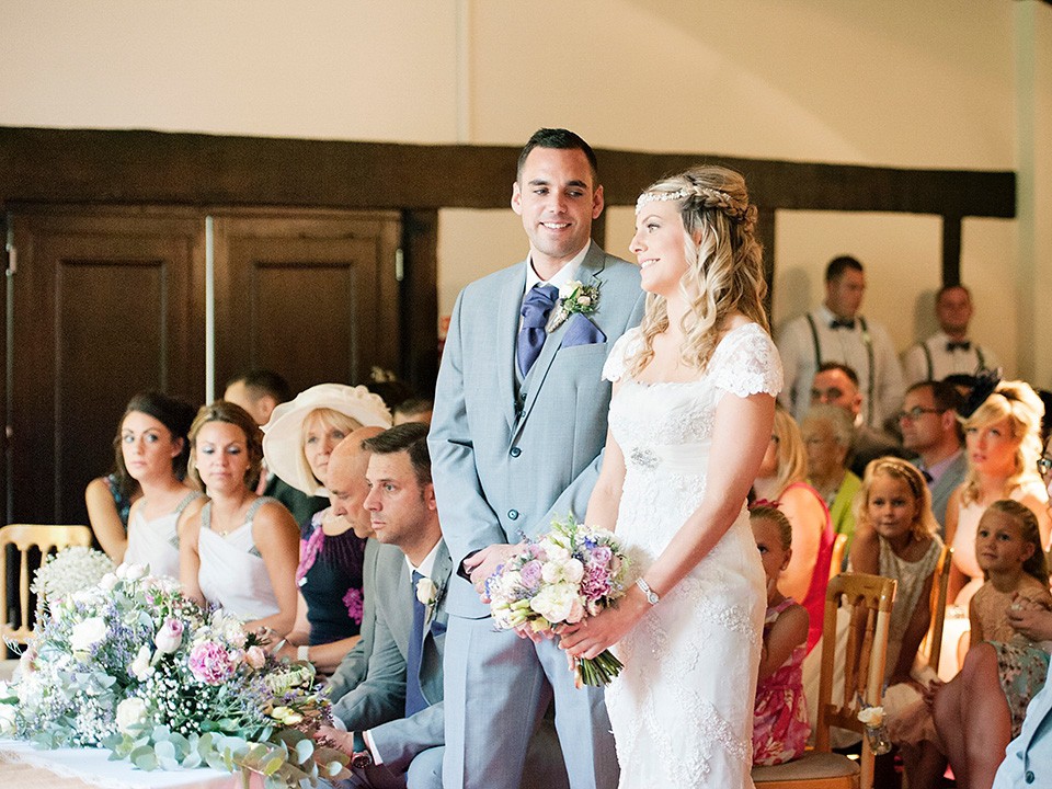 The bride wears a Bo & Luca headpiece and pretty Pronovias gown for her Summer country house wedding at Woodhall Manor in Suffolk. Photography by Kathryn Hopkins.