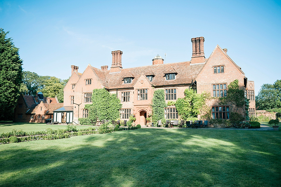 The bride wears a Bo & Luca headpiece and pretty Pronovias gown for her Summer country house wedding at Woodhall Manor in Suffolk. Photography by Kathryn Hopkins.