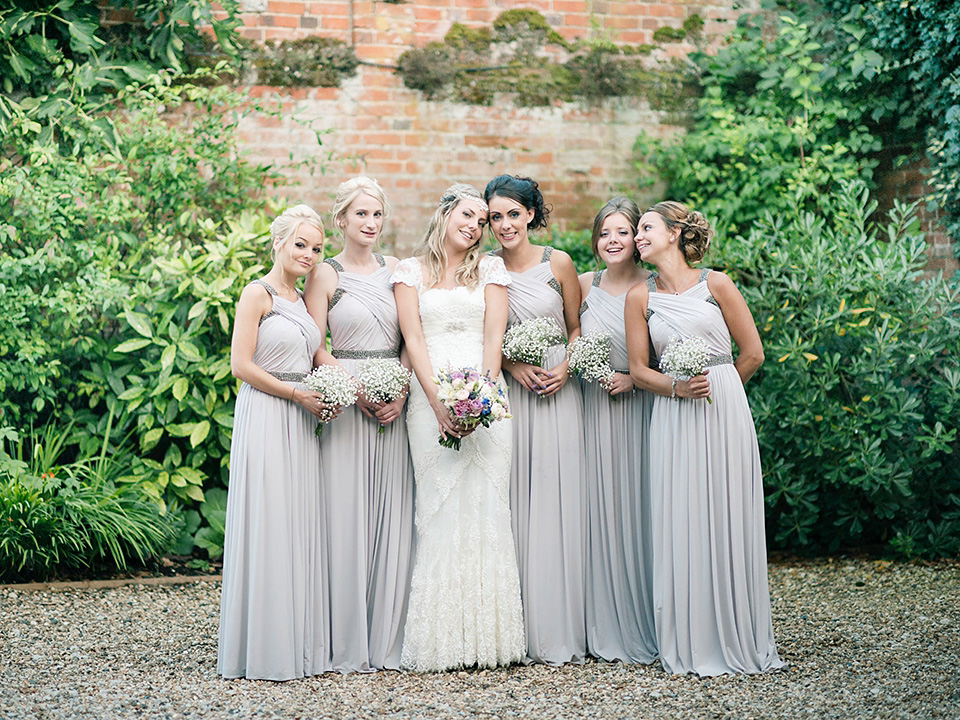 The bride wears a Bo & Luca headpiece and pretty Pronovias gown for her Summer country house wedding at Woodhall Manor in Suffolk. Photography by Kathryn Hopkins.