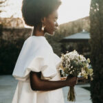 Black bride wearing bridal fashion from Miss Bush bridal boutique.