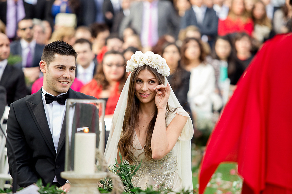 A bride wearing a sequin BHLDN gown for her boho-luxe outdoor ceremony wedding in Spain. Photography by Susana Rios. Boho Luxe wedding, sequin BHLDN wedding dress, BHLDN flowergirl tutus, outdoor wedding ceremony, wedding in Spain, floral crown // Susana Rios Photography.