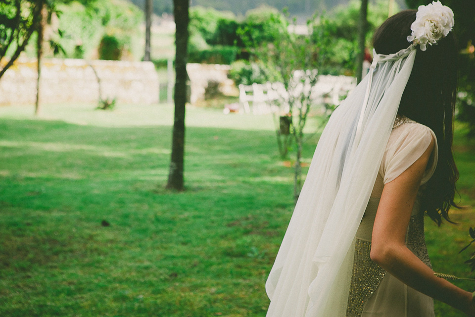 A bride wearing a sequin BHLDN gown for her boho-luxe outdoor ceremony wedding in Spain. Photography by Susana Rios. Boho Luxe wedding, sequin BHLDN wedding dress, BHLDN flowergirl tutus, outdoor wedding ceremony, wedding in Spain, floral crown // Susana Rios Photography.