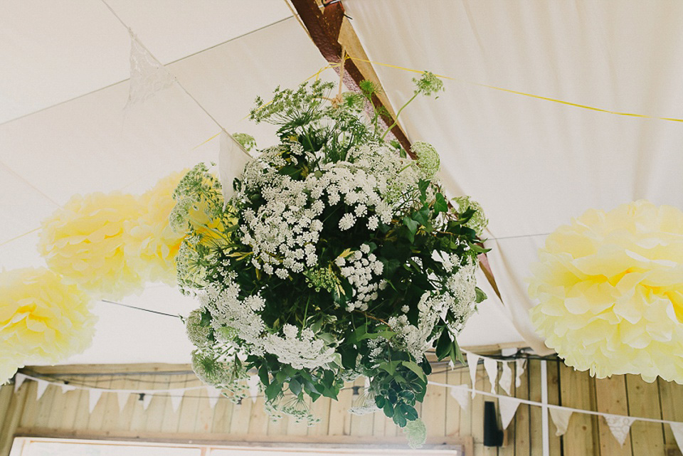 A boho bride wearing a Charlie Brear dress and veil for her woodland festival wedding at Hawthbush Farm in Sussex. Photography by Modern Vintage Weddings.