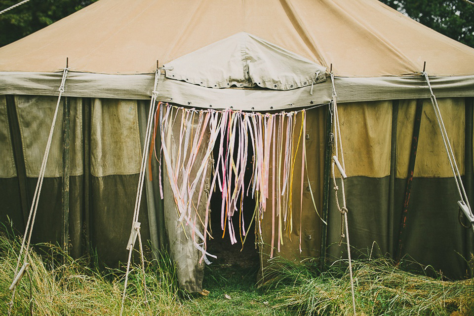 A boho bride wearing a Charlie Brear dress and veil for her woodland festival wedding at Hawthbush Farm in Sussex. Photography by Modern Vintage Weddings.