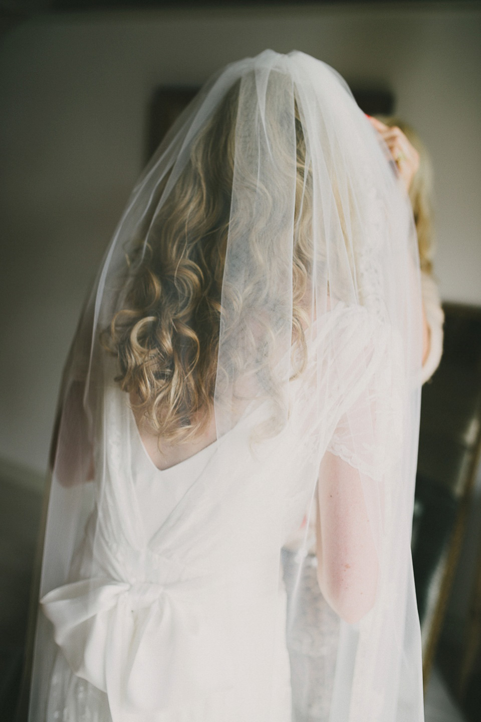 A boho bride wearing a Charlie Brear dress and veil for her woodland festival wedding at Hawthbush Farm in Sussex. Photography by Modern Vintage Weddings.