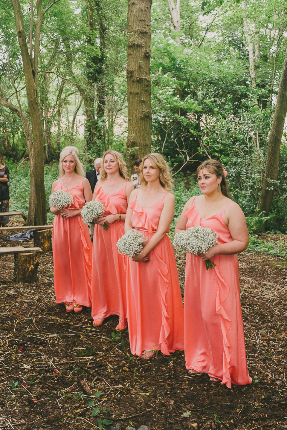 A boho bride wearing a Charlie Brear dress and veil for her woodland festival wedding at Hawthbush Farm in Sussex. Photography by Modern Vintage Weddings.