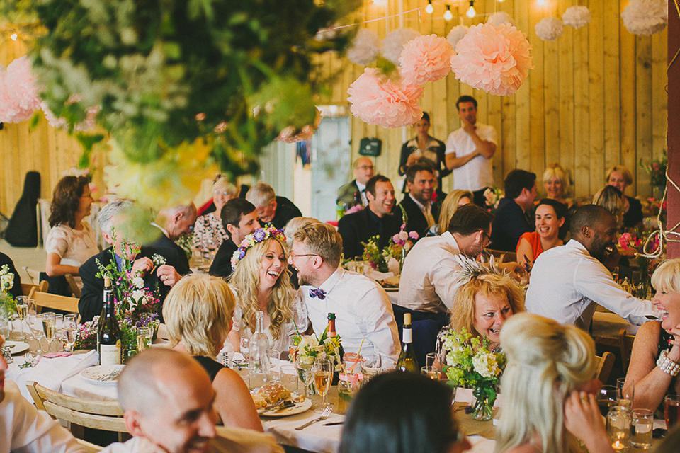 A boho bride wearing a Charlie Brear dress and veil for her woodland festival wedding at Hawthbush Farm in Sussex. Photography by Modern Vintage Weddings.