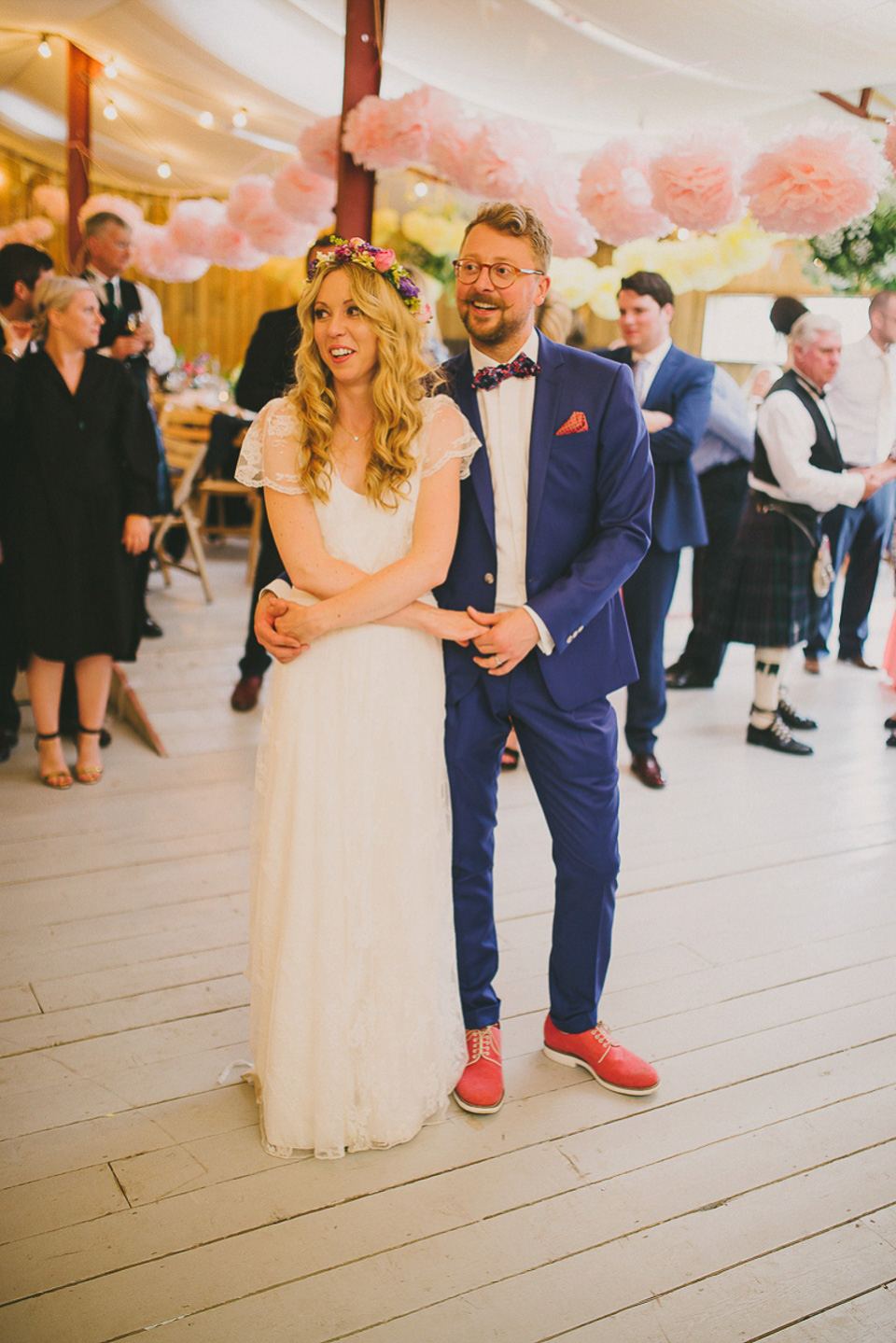 A boho bride wearing a Charlie Brear dress and veil for her woodland festival wedding at Hawthbush Farm in Sussex. Photography by Modern Vintage Weddings.