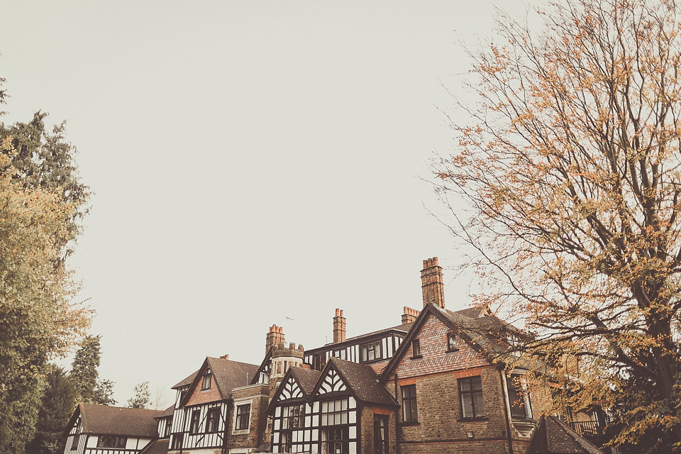 The bride wears YolanCris for her rustic, late Autumn barn wedding at Ramster Hall in Chiddingford, Surrey. Photography by Michelle Lindsell.