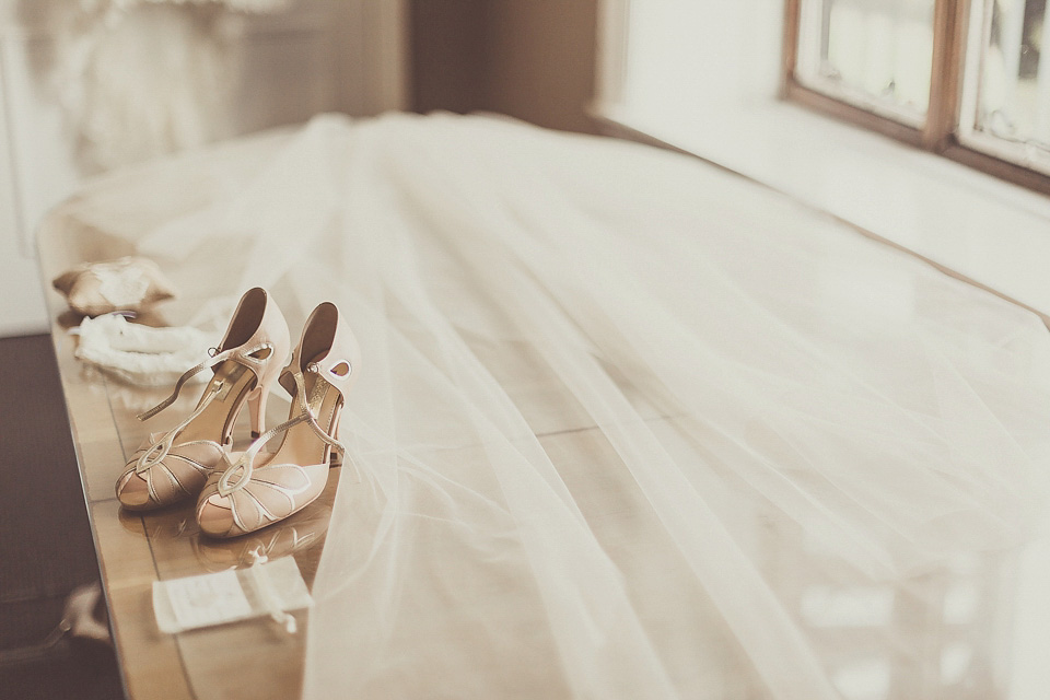 The bride wears YolanCris for her rustic, late Autumn barn wedding at Ramster Hall in Chiddingford, Surrey. Photography by Michelle Lindsell.