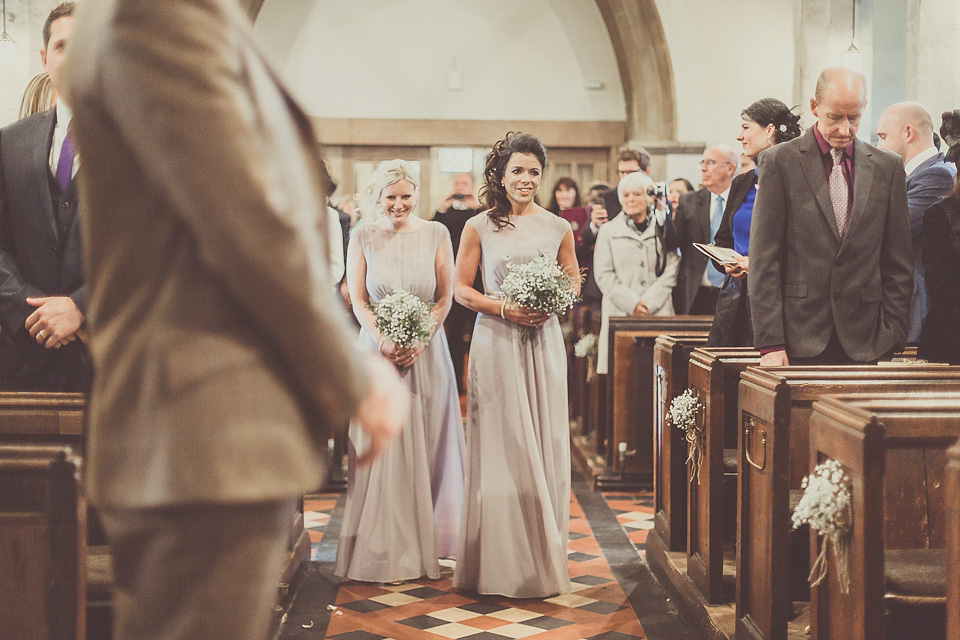 The bride wears YolanCris for her rustic, late Autumn barn wedding at Ramster Hall in Chiddingford, Surrey. Photography by Michelle Lindsell.