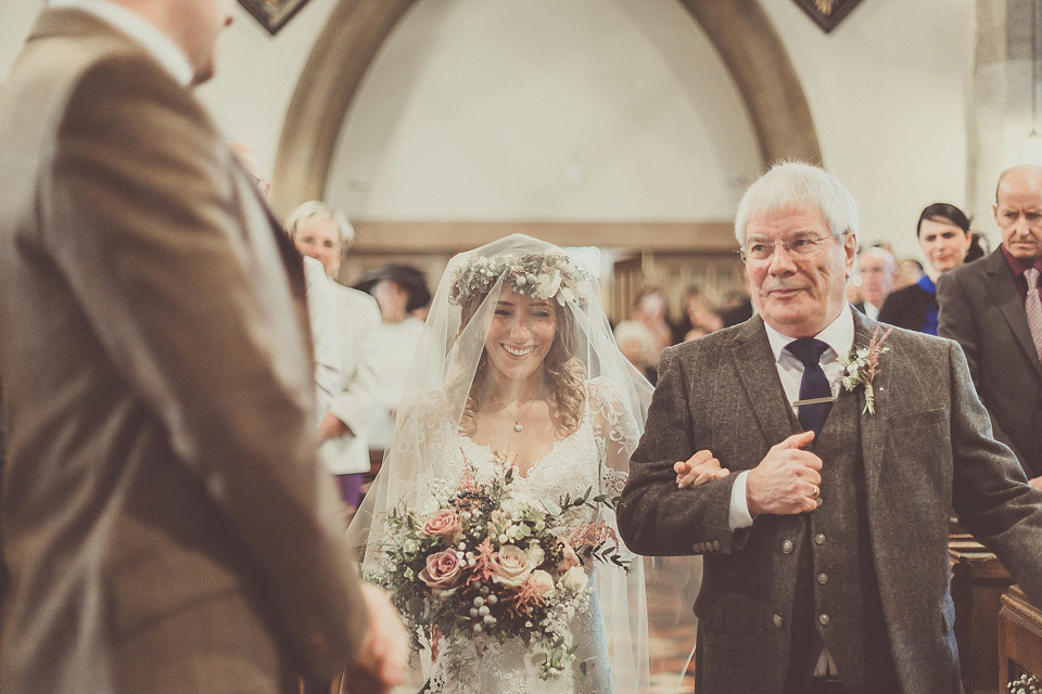 The bride wears YolanCris for her rustic, late Autumn barn wedding at Ramster Hall in Chiddingford, Surrey. Photography by Michelle Lindsell.