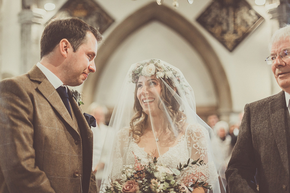 The bride wears YolanCris for her rustic, late Autumn barn wedding at Ramster Hall in Chiddingford, Surrey. Photography by Michelle Lindsell.