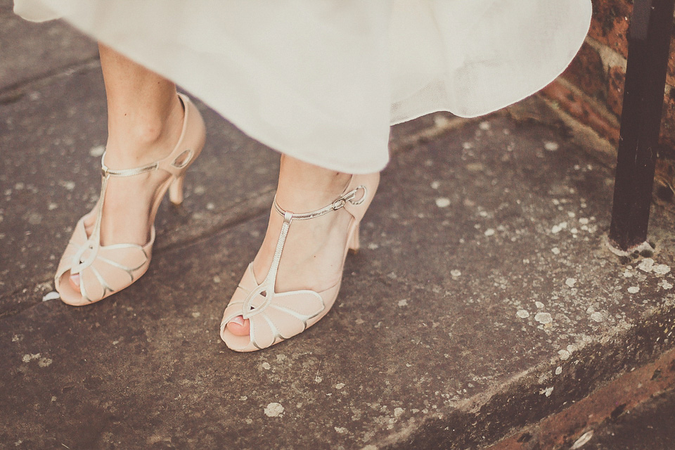 The bride wears YolanCris for her rustic, late Autumn barn wedding at Ramster Hall in Chiddingford, Surrey. Photography by Michelle Lindsell.