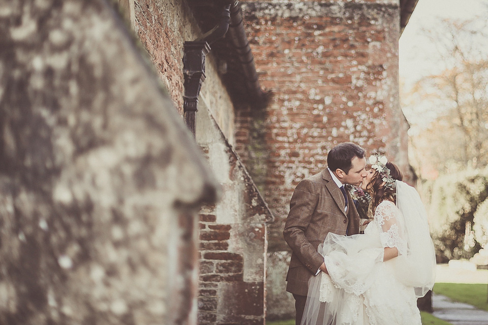 The bride wears YolanCris for her rustic, late Autumn barn wedding at Ramster Hall in Chiddingford, Surrey. Photography by Michelle Lindsell.