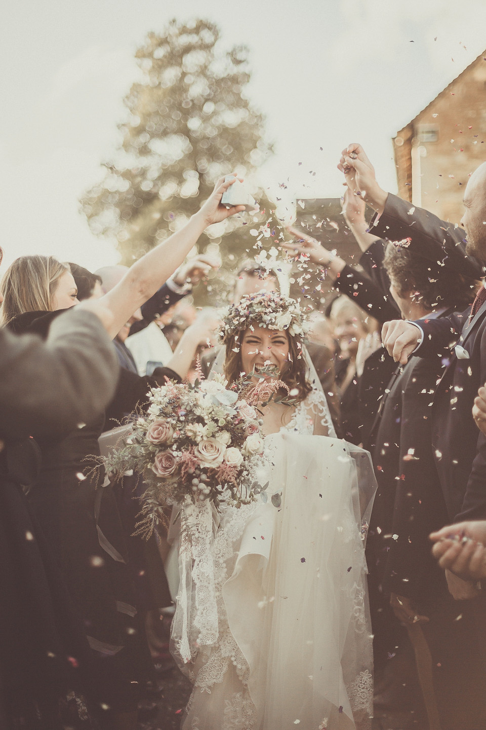 The bride wears YolanCris for her rustic, late Autumn barn wedding at Ramster Hall in Chiddingford, Surrey. Photography by Michelle Lindsell.