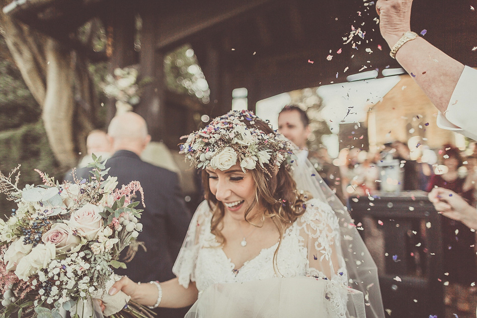 The bride wears YolanCris for her rustic, late Autumn barn wedding at Ramster Hall in Chiddingford, Surrey. Photography by Michelle Lindsell.